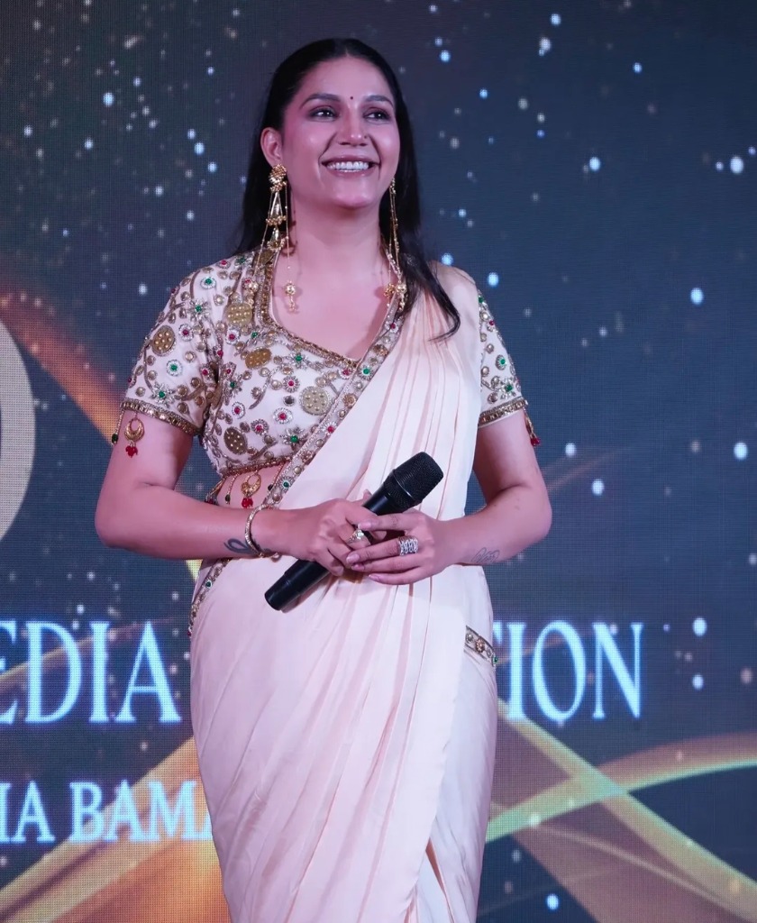 Sapna Choudhary smiling on stage